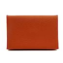 Porte-cartes Hermes Calvi en cuir orange - Hermès