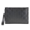 Gucci GG Embossed Leather Clutch Bag