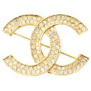 Broche en strass doré Chanel