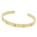 Bracelet ouvert Cartier Love en or jaune 18K avec diamant