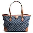 Bolsa tote média em denim GG Gucci