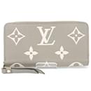 Portefeuille long zippé rond Monogram Empreinte Louis Vuitton