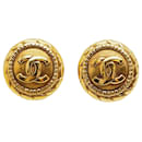 Boucles d'oreilles rondes en or vintage Chanel avec le logo Coco