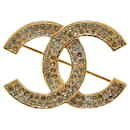 Broche en strass plaquée or Chanel Coco Mark