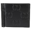 Billetera bi-fold con clip para dinero Gucci GG grabado