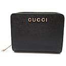 Billetera de cuero plegable Gucci