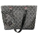 Bolsa tote grande em tweed matelassê Chanel Ligne Cambon