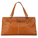 Tote en cuir orange Dior avec poches en jean