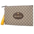 Gucci Brown GG Supreme Clutch Bag