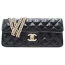 Borsa da sera stella est-ovest in vernice trapuntata nera Chanel con glitter