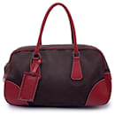 Sac à dos en toile marron vintage avec cuir rouge B10804 - Prada