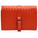 Portefeuille en cuir intrecciato rouge Bottega Veneta