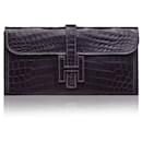 Bolsa de Clutch Jige PM Exotic em Prune Niloticus da Hermès