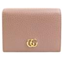 Portefeuille bi-fold Gucci en cuir beige