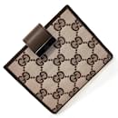 Portefeuille bi-fold en toile GG Gucci