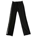 Pantalons noirs à fermeture éclair latérale Gucci par Tom Ford.