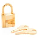 NINE HERMES PADLOCKS + 2 KEYS 101 FOR KELLY BIRKIN BAG IN GOLD PLATED METAL - Hermès