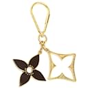 Llave de puzzle chapada en oro de Louis Vuitton y charm de bolso