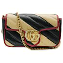 Gucci Super Mini GG Marmont Torchon Tasche aus schwarzem und beigem Kalbsleder