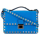 Bolso de cuero azul Valentino Rockstud con solapa