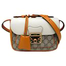 Bolso de hombro de lona Gucci GG Supreme con bolsillo frontal y candado