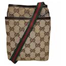 Bolso Pochette Shelly de lona y cuero Gucci