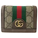 Portafoglio compatto in tela GG Supreme Ophidia di Gucci