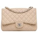 Bolsa Chanel Jumbo Classic Caviar com aba única marrom