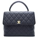 Sac à main en cuir caviar matelassé Chanel