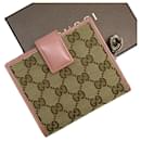 GUCCI Bi-fold Wallet in GG Canvas - Gucci