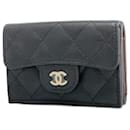 Portefeuille pliant Chanel en cuir caviar noir