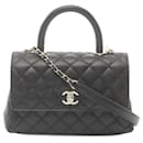 Sac à main matelassé en cuir caviar noir Chanel