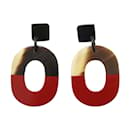 Boucles d'oreilles clous bicolores marron et rouge Hermes - Hermès