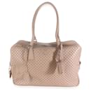 Bolso Bauletto de piel de ternera perforada beige de Prada