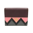 Billetera bi-fold Prada en burdeos y rosa