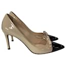 Prada Cap Toe Bow Detail Pumps in Beige Patent Leather 