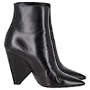  Saint Laurent Pyramid-Heeled Ankle Boots in Black Leather