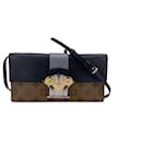 Bolsa Clutch Coluna de Canvas Reverso Monograma - Louis Vuitton