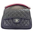 Timeless Chanel with handle and signature chain strap