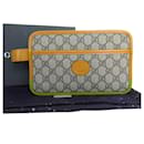 Gucci GG Supreme Clutch Bag