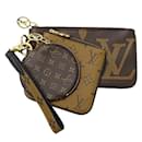 Pochete Monogram Reverso Louis Vuitton