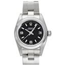 Montre Rolex Oyster Perpetual 24 76080 avec cadran noir à chiffres arabes pour femmes