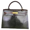 Kelly bag Hermès 32 cm in dark brown Porosus crocodile leather, new gold jewelry.