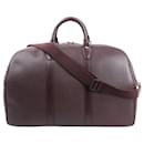 Louis Vuitton Taiga Kendall Travel bag in Burgundy
