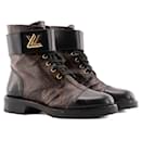 LOUIS VUITTON - Bottines Wonderland Louis Vuitton en cuir et toile monogrammée (T38)