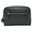 Gucci Microguccissima Leather Clutch Bag