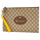 Gucci GG Supreme Clutch Bag