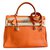 Hermès Magnifique sac HERMES Kelly 35 cm cuir Togo orange bijouterie Palladium  ref.41525