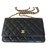 Chanel billetera en la cadena Negro Cuero  ref.43455