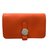 Hermès Cartera llave y tarjeta Naranja Cuero  ref.45423